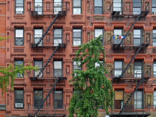 Manhattan upper east side apartment building with steel fire escape ladders - 901146201