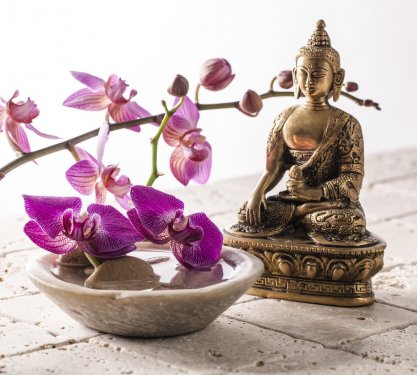 Buddha for zen attitude with stone and flowers - 901147562