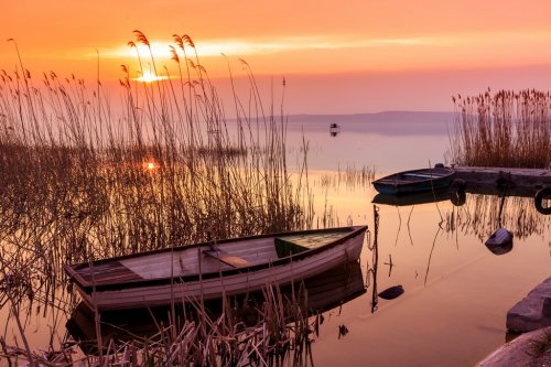 Sunset on the lake Balaton with a boat - 901147868