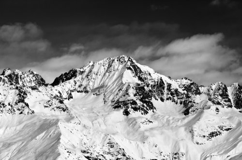 Black and white snowy mountains at sun day - 901148045