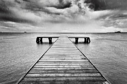 Old jetty, pier on the sea. Black and white, rain. - 901148203