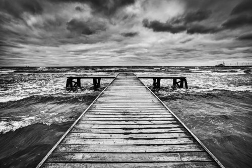 Old wooden jetty during storm on the sea. Dramatic sky - 901148204