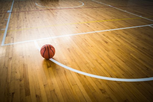 Basketball ball over floor in the gym - 901148406