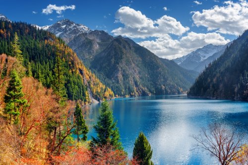 Beautiful view of the Long Lake among colorful fall woods - 901149333