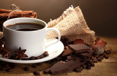 coffee cup and beans, cinnamon sticks, nuts and chocolate - 901150963