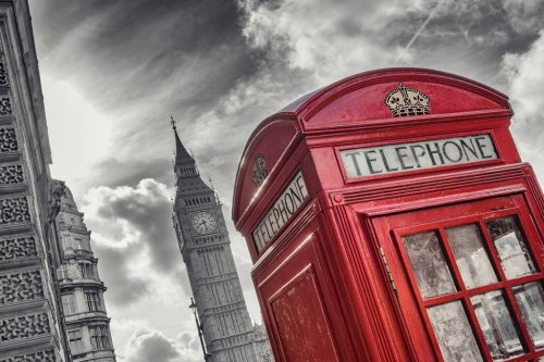 Traditional red british telephone Booth with Big Ben in London, United Kingdom
