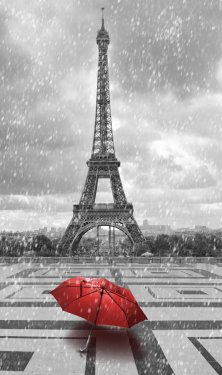 Eiffel tower in the rain. Black and white photo with red element - 901152831