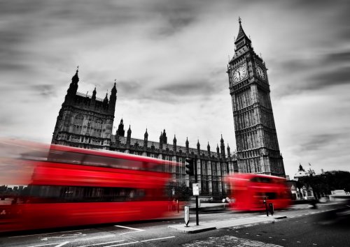 London, the UK. Red buses and Big Ben, the Palace of Westminster. Black and white