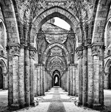 Historic ruins of abandoned abbey in black and white