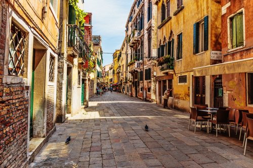 Narrow street in the old town in Venice Italy - 901154414