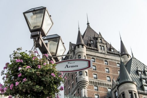 latern flowers sign Place d Armes Canada Quebec City front of Chateau Frontenac famous attraction World Heritage