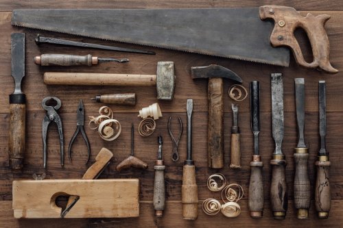 Vintage woodworking tools on the workbench - 901154719