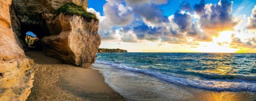 amazing sea sunset in small hidden beach in Tropea, Calabria, Italy - 901155002