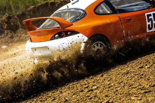 Autocross on a dusty road. Close-up of car in competition up road on a dirt r... - 901155650
