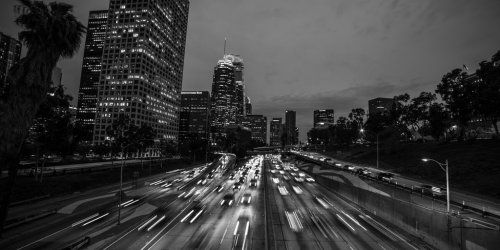 California 110 South leads to downtown Los Angeles with streaked car lights a... - 901155926
