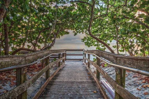 Boardwalk entering North Gulf Shore Beach in Naples Florida at Sunrise - 901155935