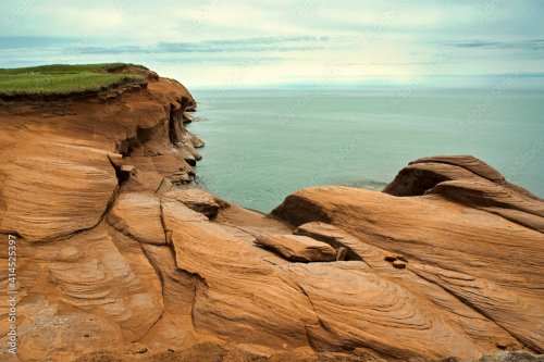 Canada, Quebec, Iles-de-la-Madeleine. Red cliffs and ocean - 901157730
