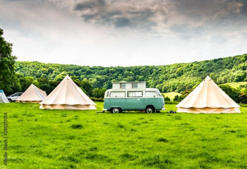 An iconic camper van at a glamping site in the English countryside