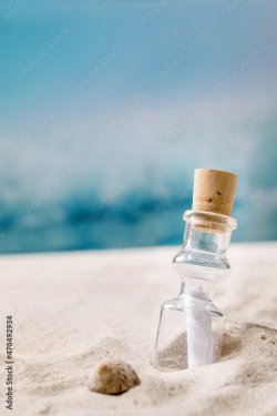 Summer sand sea beach with waves and glass botle with message